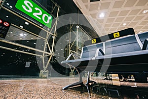 Empty Priority seats, chairs in the airport hall near departure gate at international airport reserved for disability