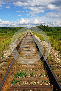 An empty railway disappearing into perspective