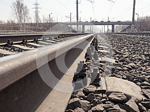 Empty railway, rails, sleepers, rubble close up, wide angle, toned brown, selective focus