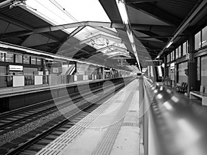 Empty railway station black and white.