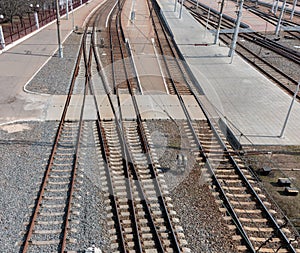 Empty railway tracks on wooden sleepers.