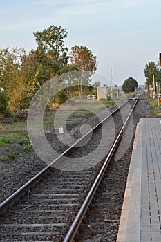 Empty railways on sunset sky background