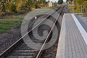 Empty railways on sunset sky background