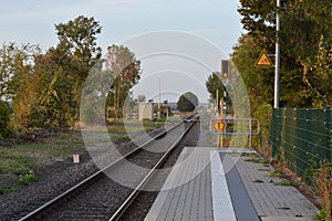 Empty railways on sunset sky background