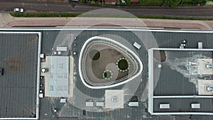 Empty rainbow beautiful new modern school in a small village. aerial wiev