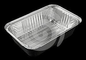 Empty rectangular aluminum foil baking pan on black background