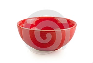 Empty red bowl on white background