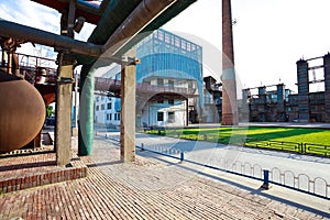 Empty red brick road surface floor with old steel steelworks of