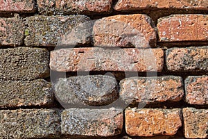 close-up view of red grungy very old brick wall textured background