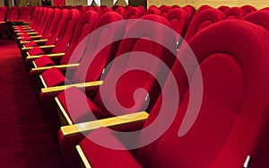 Empty red chairs. Chairs of cinema, theatre, auditorium