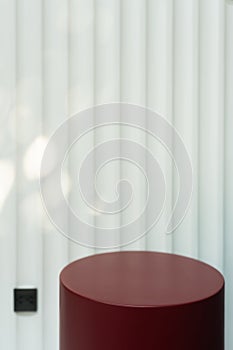 Empty red circular podium display on white wooden background with tree shadow red rectangle stand concept. Blank product shelf