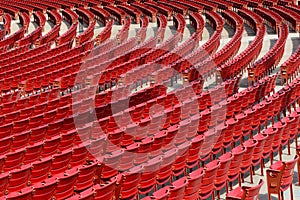 Empty red outdoor seats photo