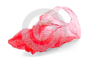 Empty red plastic bag on white background