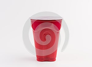 Empty red plastic cup isolated