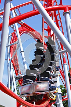 Empty red roller coaster photo