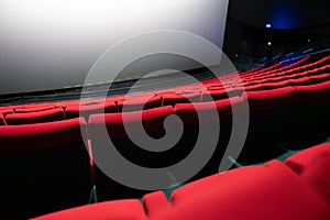 Empty red seats in a cinema auditorium