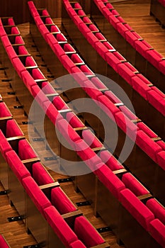 Empty red seats in a conference room