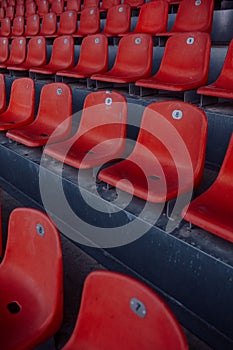 Empty red seats in a sports stadium