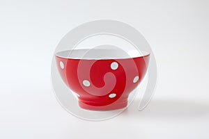 Empty red and white polka dot bowl