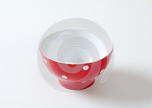 Empty red and white polka dot bowl