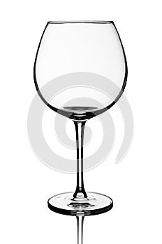 Empty red wine glass isolated over white background