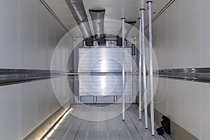 Empty refrigerated truck inside, with cargo area lighting. Interior of van for transporting frozen food