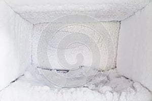 Empty of a refrigerator. Ice buildup inside of a freezer walls