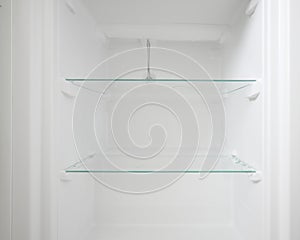An empty refrigerator. Inside an empty, clean refrigerator, a refrigerator compartment after defrosting