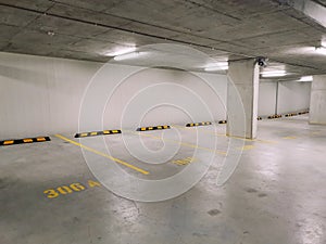 Empty residential apartment underground carpark photo