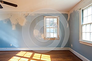 Empty Residential Bedroom in the Middle of Renovation with Walls that Need to be Painted