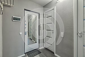 Empty residential house entrance with closed doors