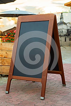 Empty restaurant menu blackboard on the street, menu chalkboard mockup, menu board template