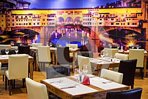 Empty restaurant. Table in Italian restaurant with a glass and cutlery