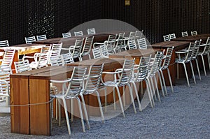 Empty restaurant tables and chairs