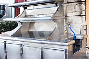 An empty restaurant workstand made of stainless steel .