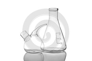 Empty retort and conical flasks on background. Laboratory glassware