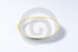 Empty rimmed dinner plate