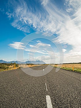 Empty road with a blue cloudy sky, Iceland