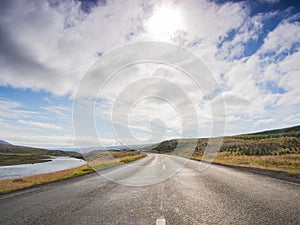 Empty road with a blue cloudy sky, Iceland