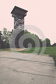 empty road in the countryside with watchtower - retro vintage lo