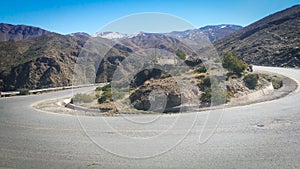 Empty road in curve in Atlas mountains in Morocco in a sunny day