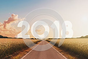 Empty road heading happy new year 2018