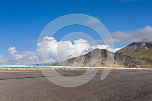 Empty highway on kunlun mountain hinterland photo