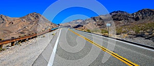 Empty road with mountains behind in Arizona, USA