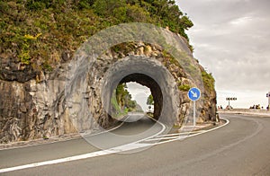 Empty road in the mountains, Spain. Curve highway with signpost horizontal. Destination concept. Transportation and travel concept