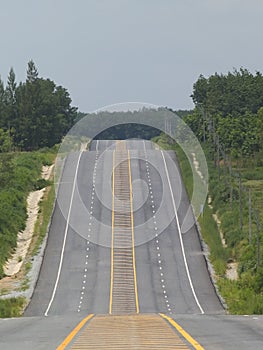 Empty road over a hill