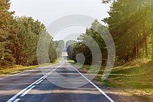 Empty road receding into the distance, becomes a point on the horizon