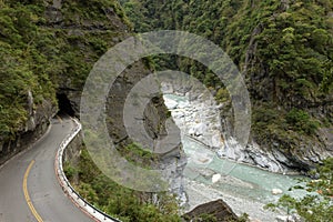 Empty road at a rugged, rocky and lush landscape at Taroko