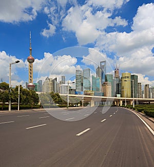 Empty road with Shanghai Lujiazui city buildings