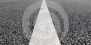 An empty road with single solid white line road marking